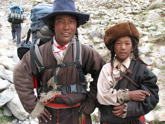 These two young Tibetan guys carried one of our backpacks for a small fee. Mt. Kailash, Tibet.